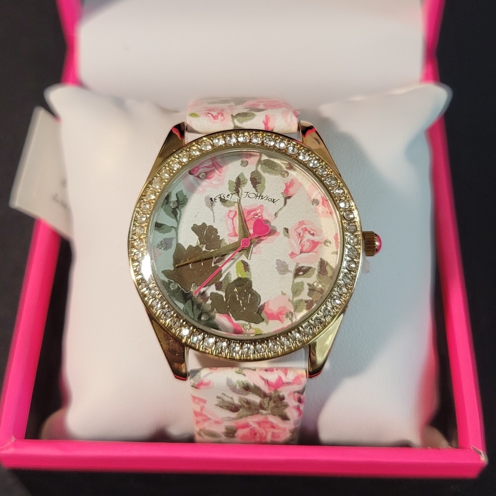 Betsey Johnson pink, white, and green floral watch.